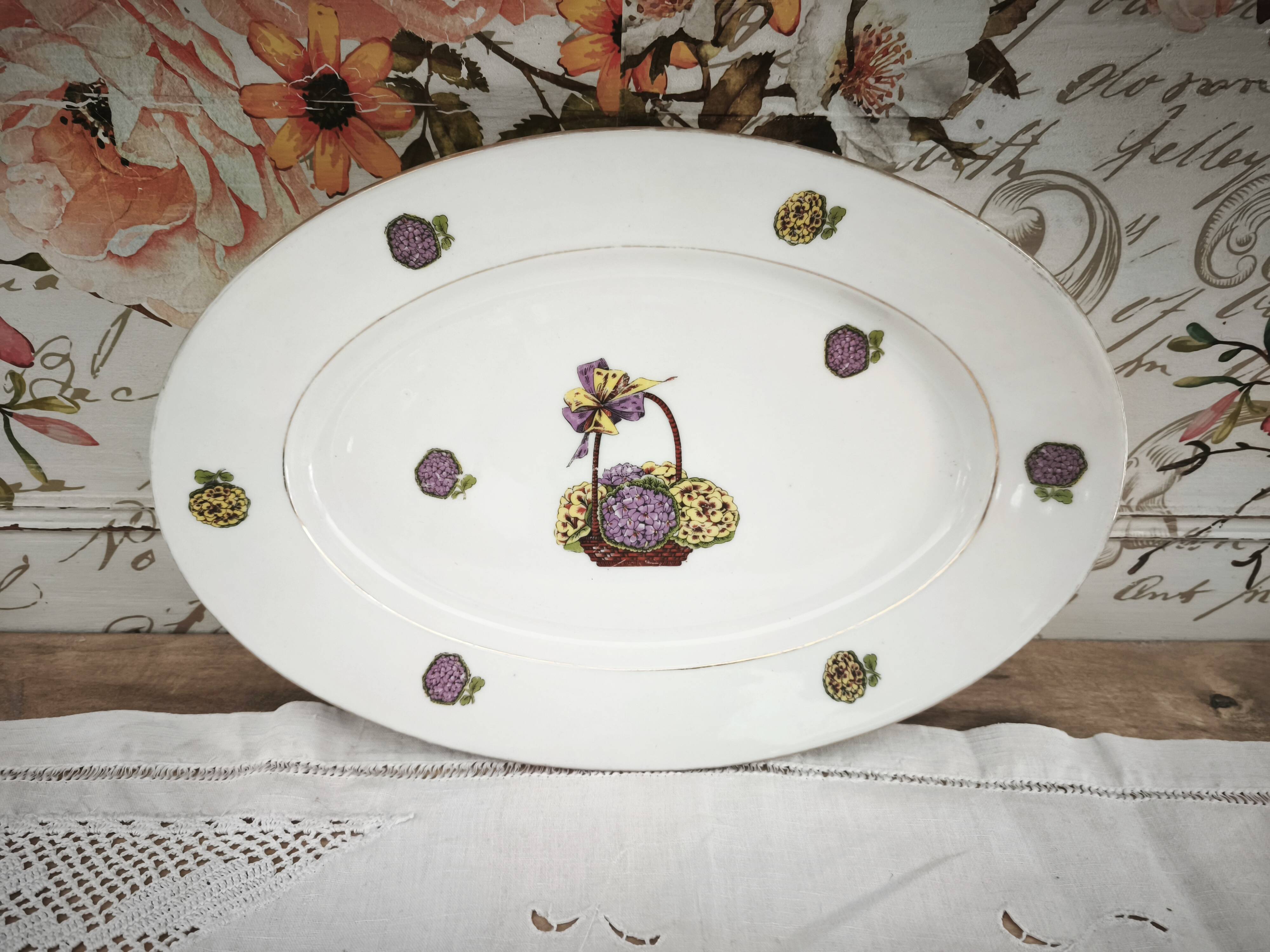Oval porcelain plate from Limoges with a hydrangea basket design.