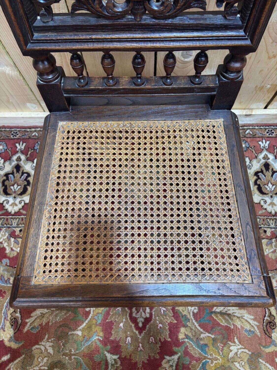 6 High Era chairs in carved solid oak and rattan caning.