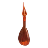 Orange bubbled glass bottle with curved body, circa 1970