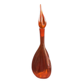 Bouteille en verre bullé orange  à panse incurvée, vers 1970