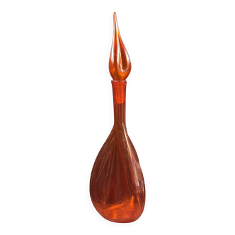Orange bubbled glass bottle with curved body, circa 1970