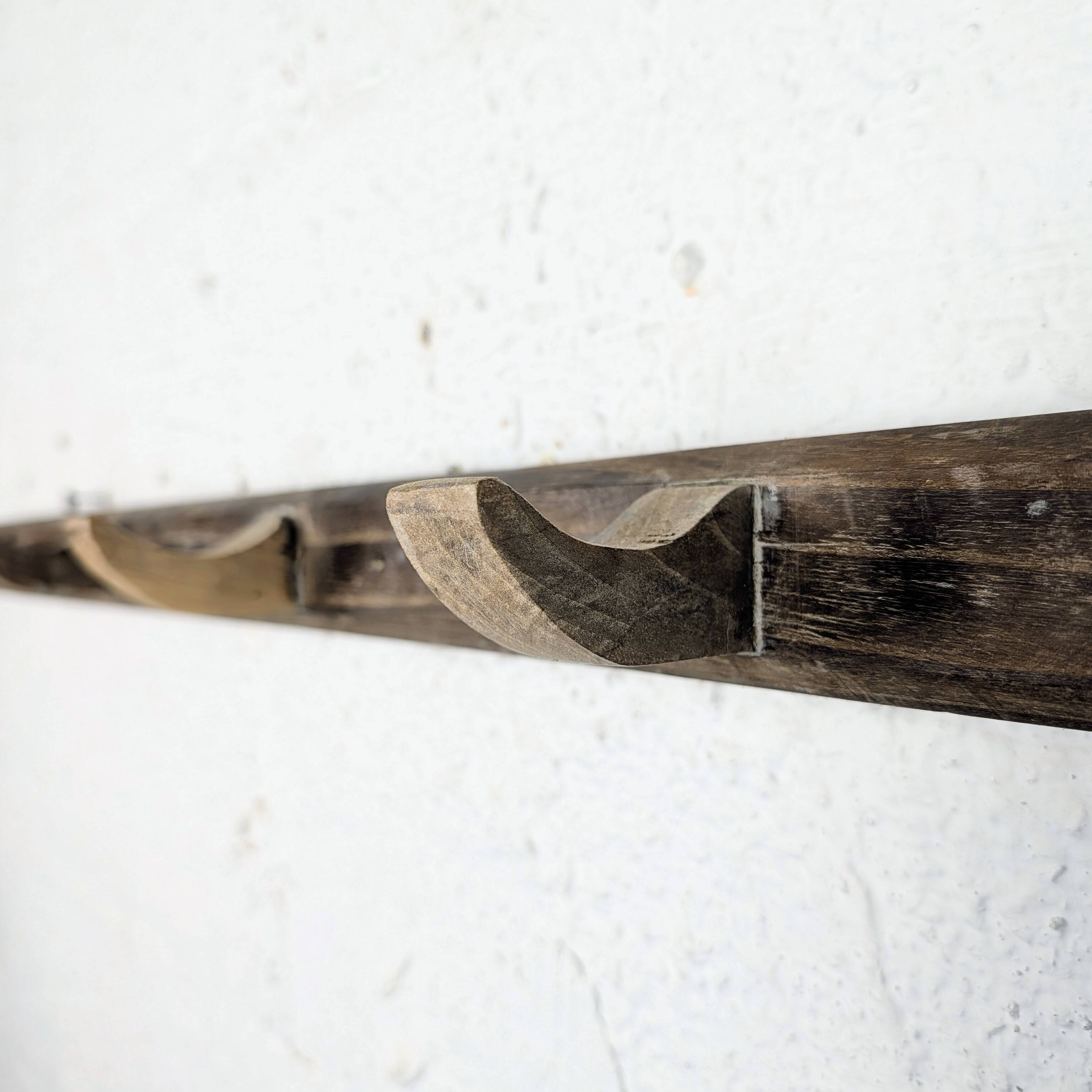 Handcrafted wall coat rack in raw wood