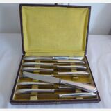 12 silver metal knives