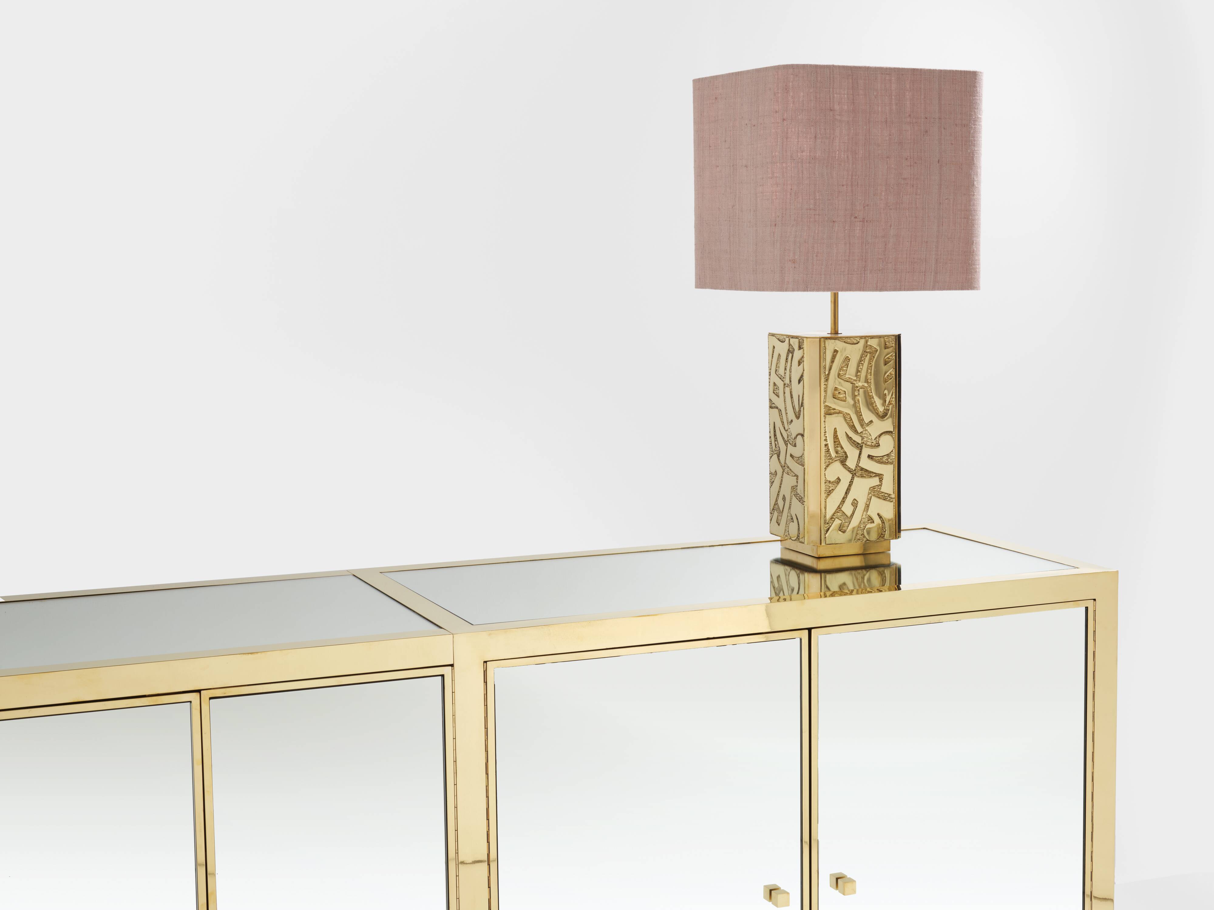 Brass sideboard with mirror and plexiglass legs by Michel Pigneres, 1970