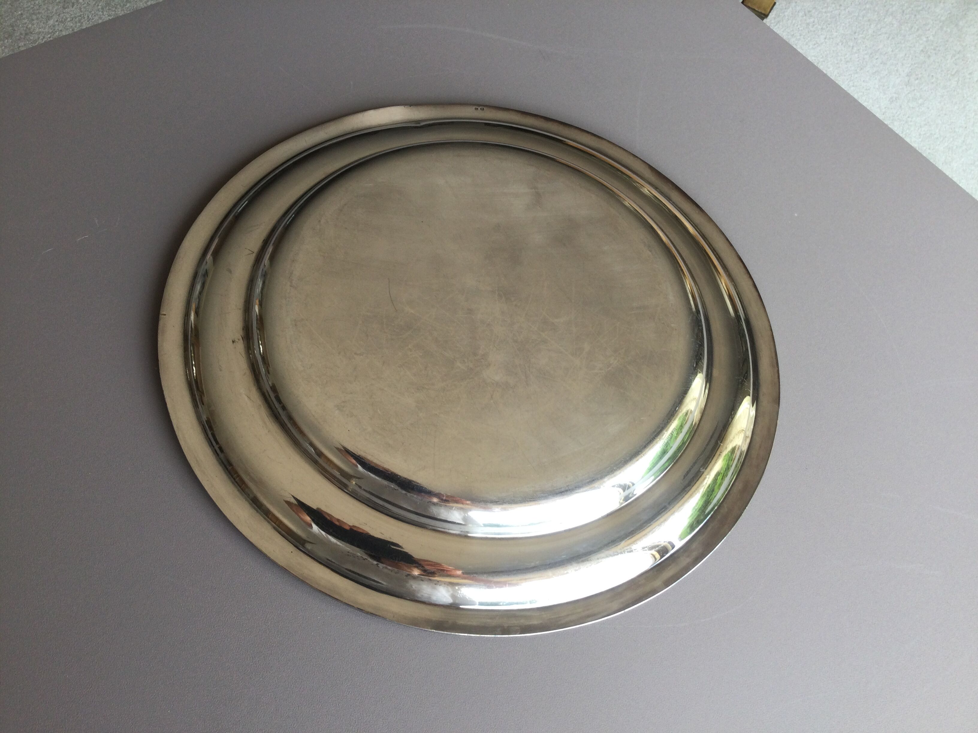 round plate in punched silver metal