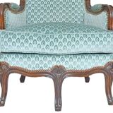 Pair of Louis XV style wingback armchairs with five legs.