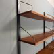 Modular wall shelf in teak in mid-century modern style, designed by Poul Cadovius for Cado, 1960.
