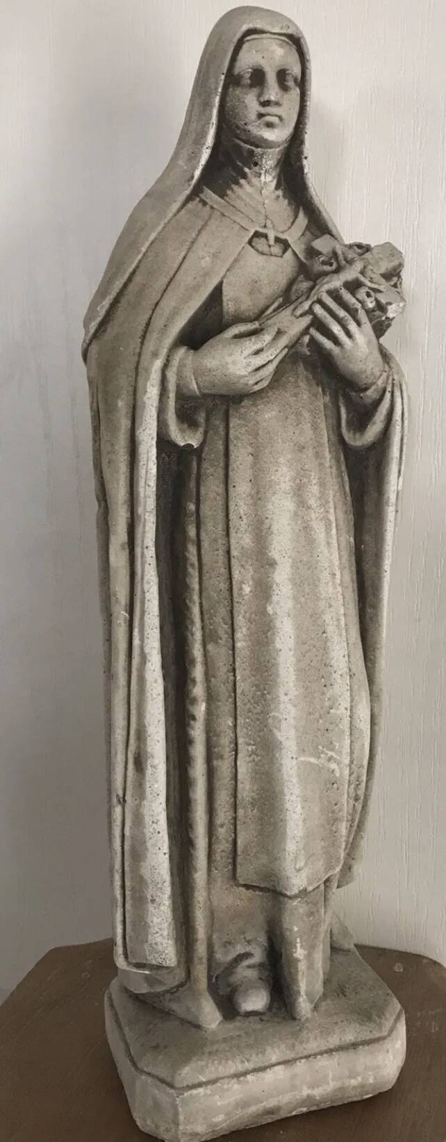 Religious statue of sainte therese of lisieux “the little flower of jesus” in stone