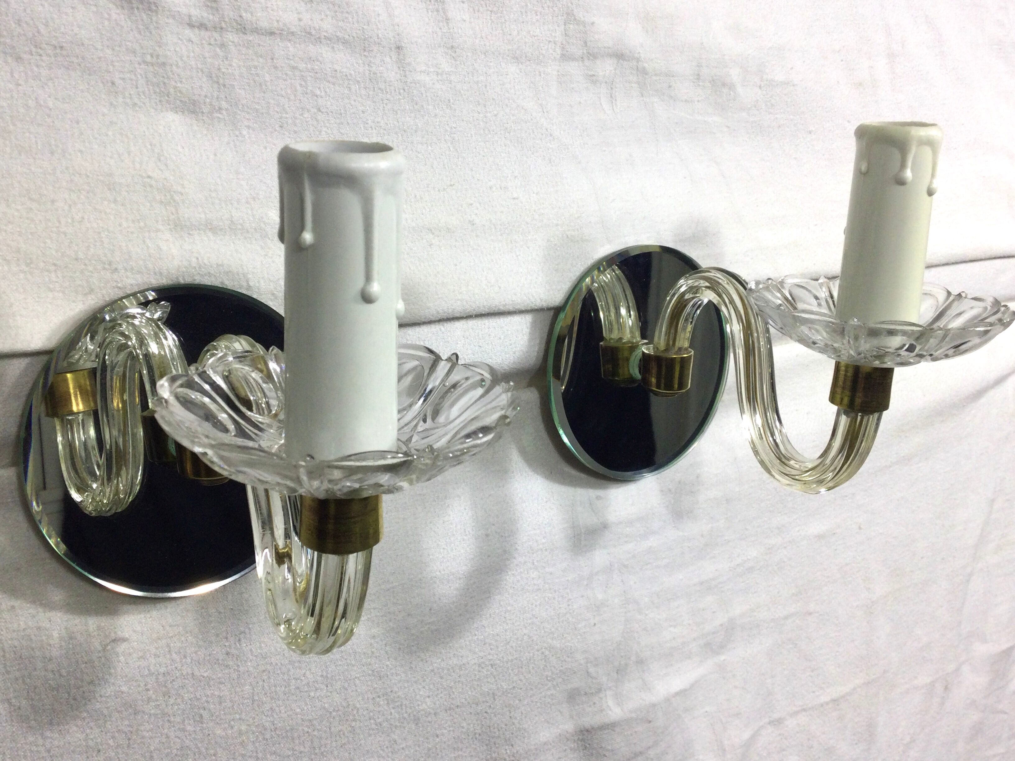 Pair of glass and mirror sconces