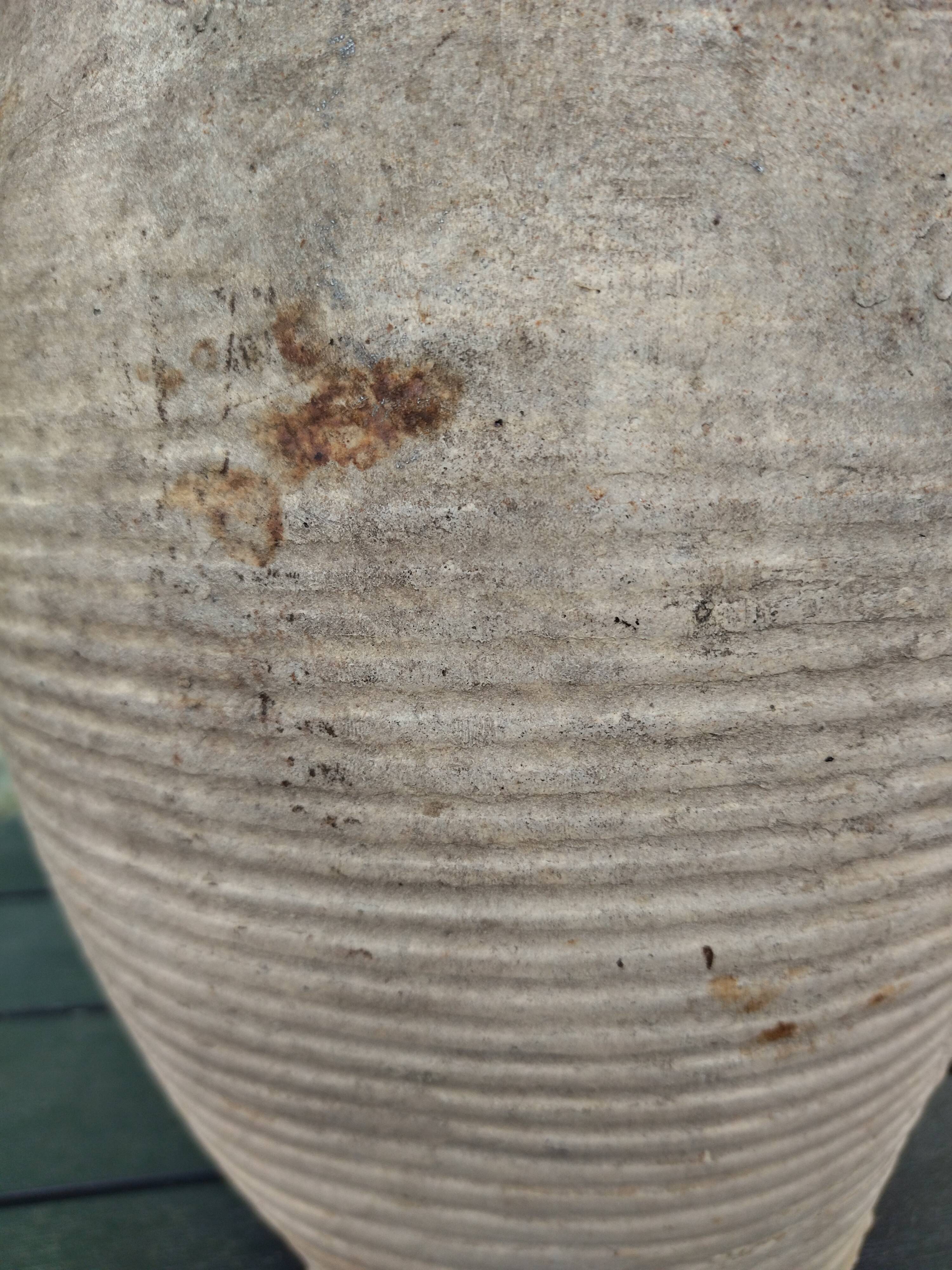 Ancient sandstone jar with two handles
