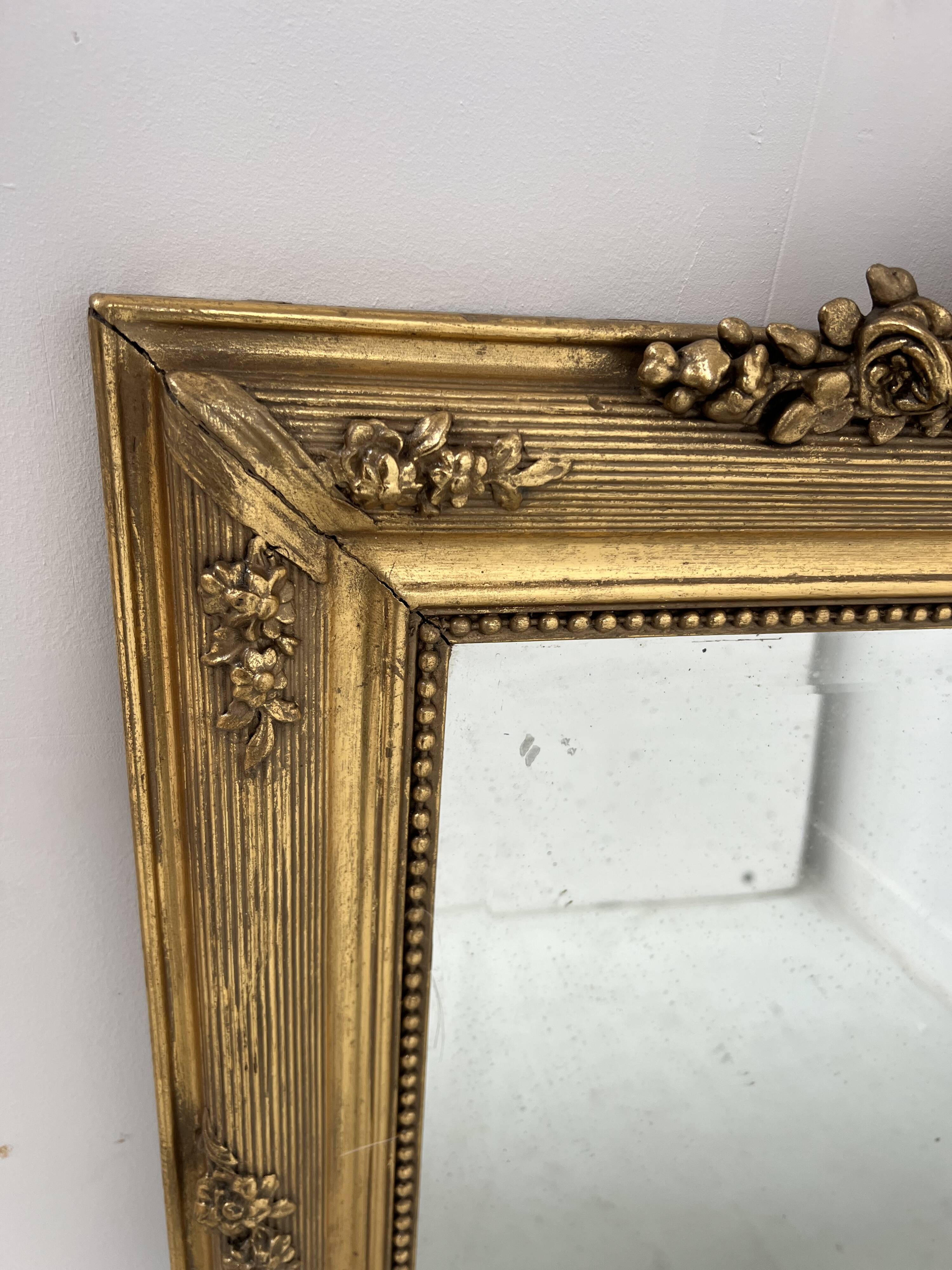 Louis XVI style mirror in wood and gilded stucco, 19th century