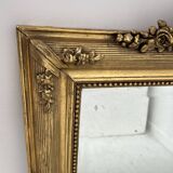 Miroir de style Louis XVI en bois et stuc doré XIX siècle