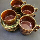 Large service in green and brown glazed stoneware with facets, signed Louis Cag.