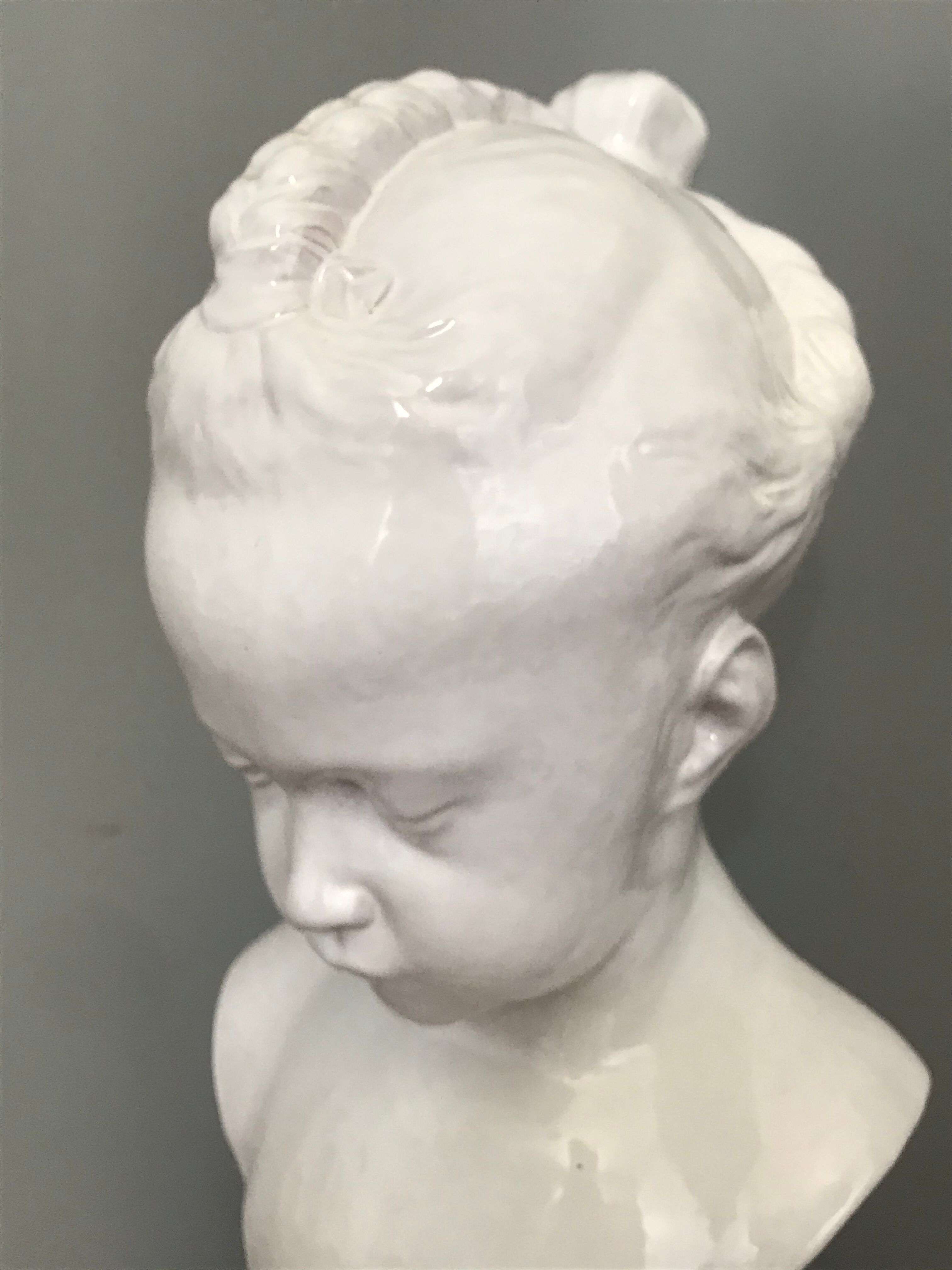 Child bust in enamelled terracotta