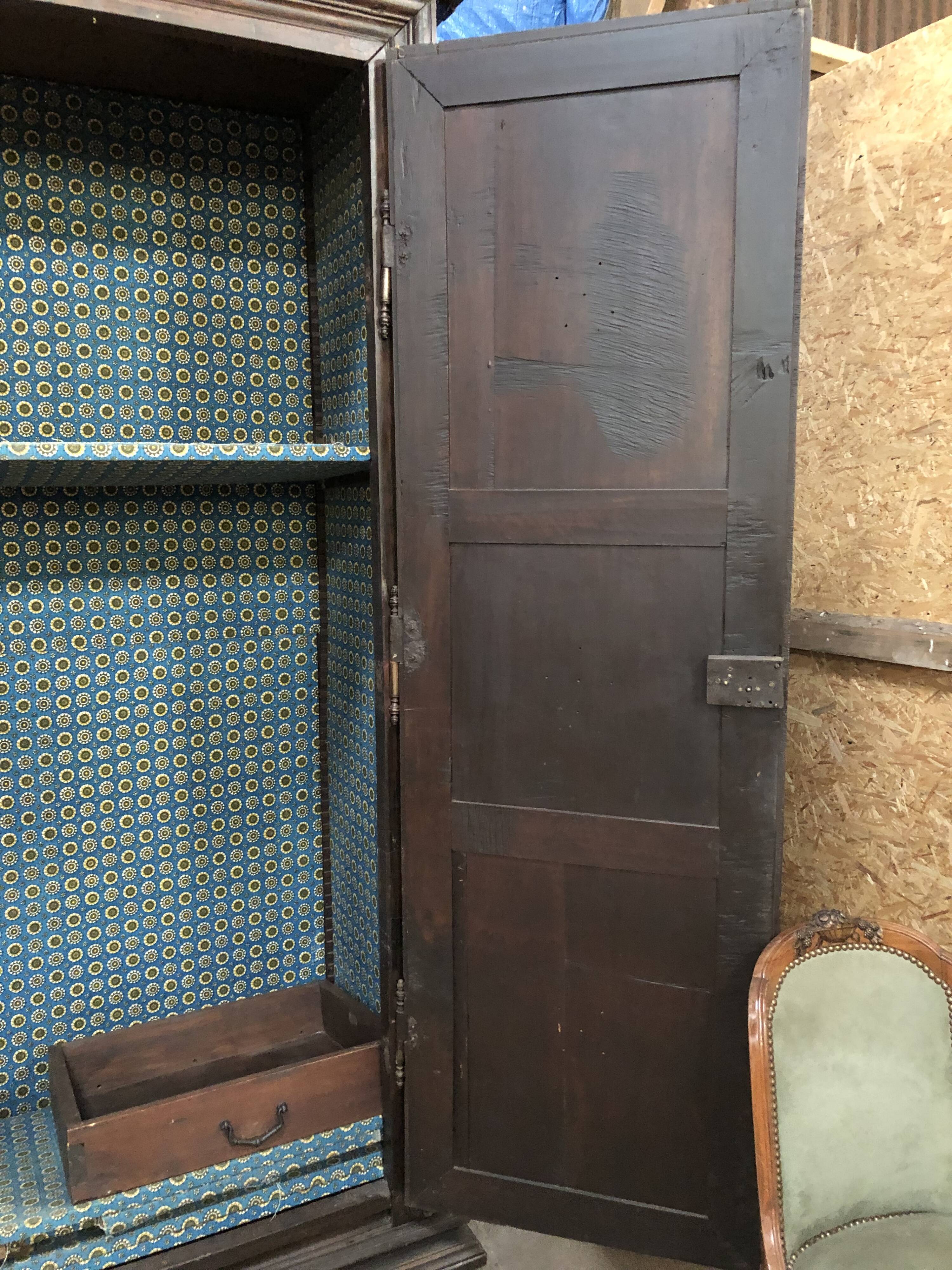 Antique Louis XIII armoire in solid walnut with carved doors