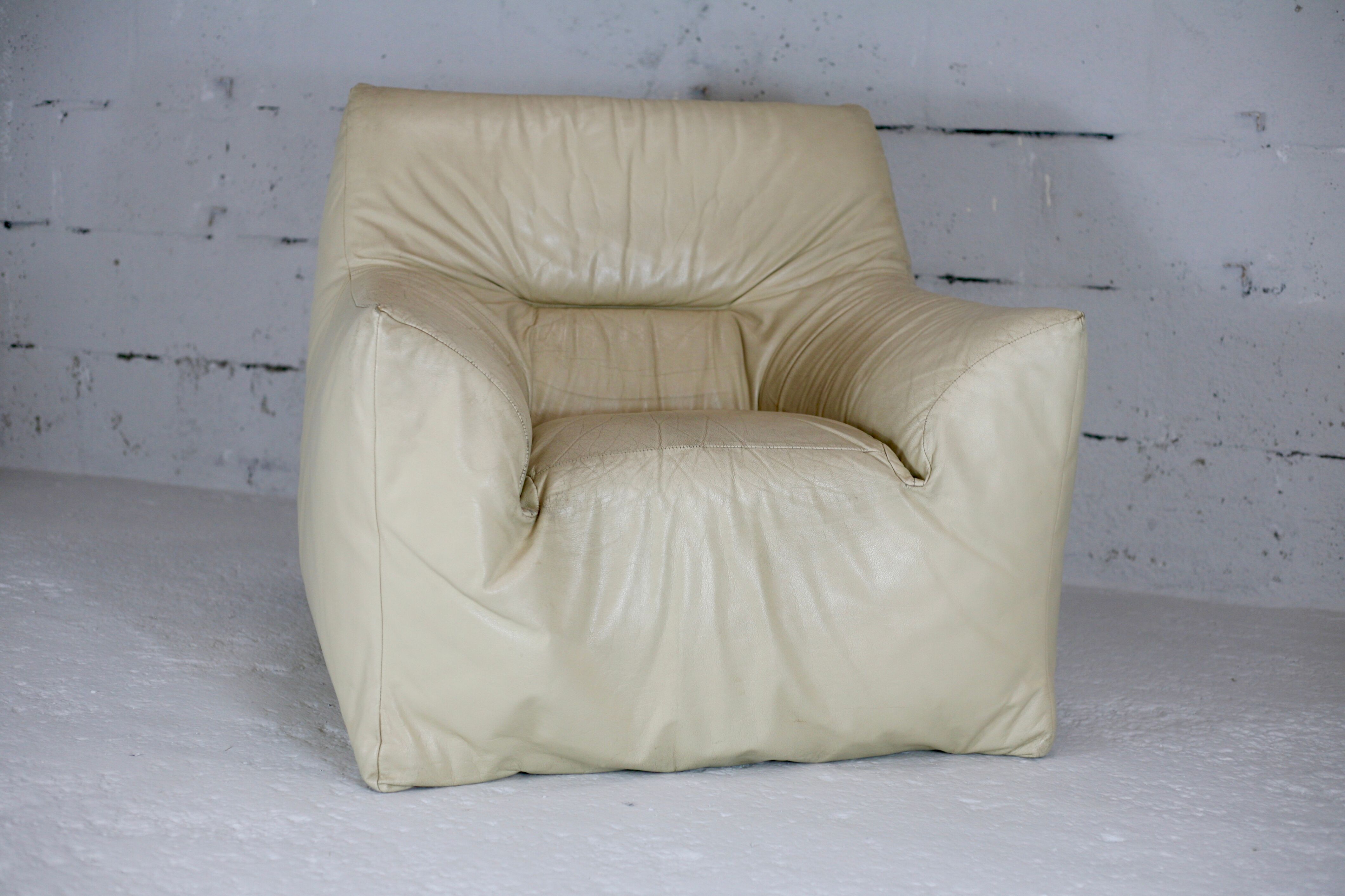 Leather armchair and cream-coloured foam, France , circa 1970