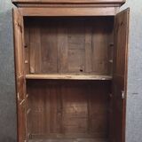 Louis XIV period wardrobe in solid oak, decorated with superb carvings