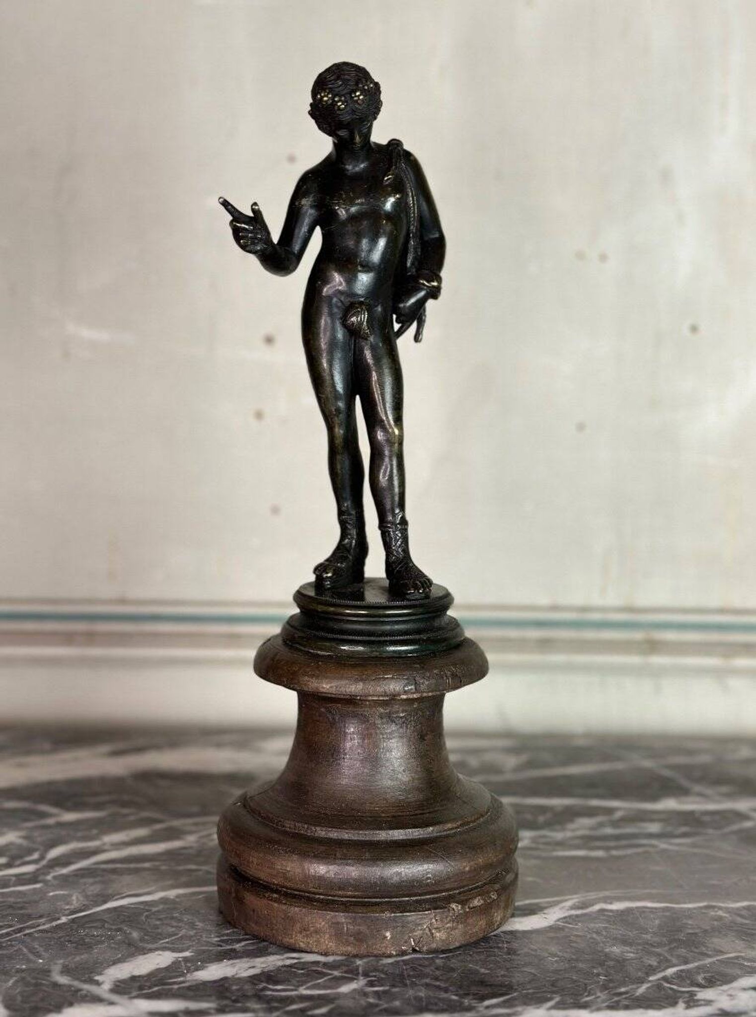 Narcissus, bronze after the antique on a wooden base, circa 1880.