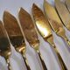 Gold metal fish cutlery, knives and forks 24 pieces