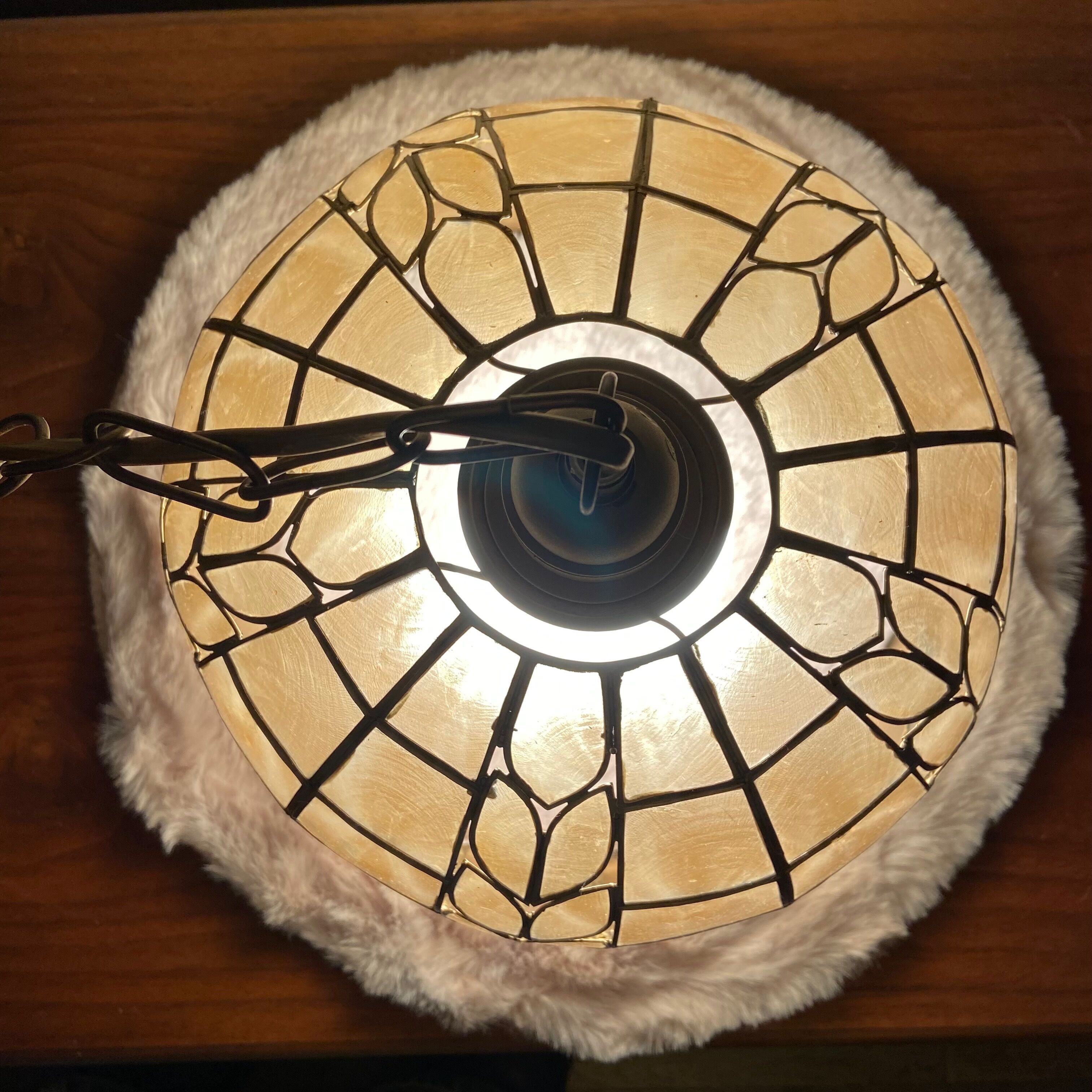 Mother-of-pearl and brass suspension