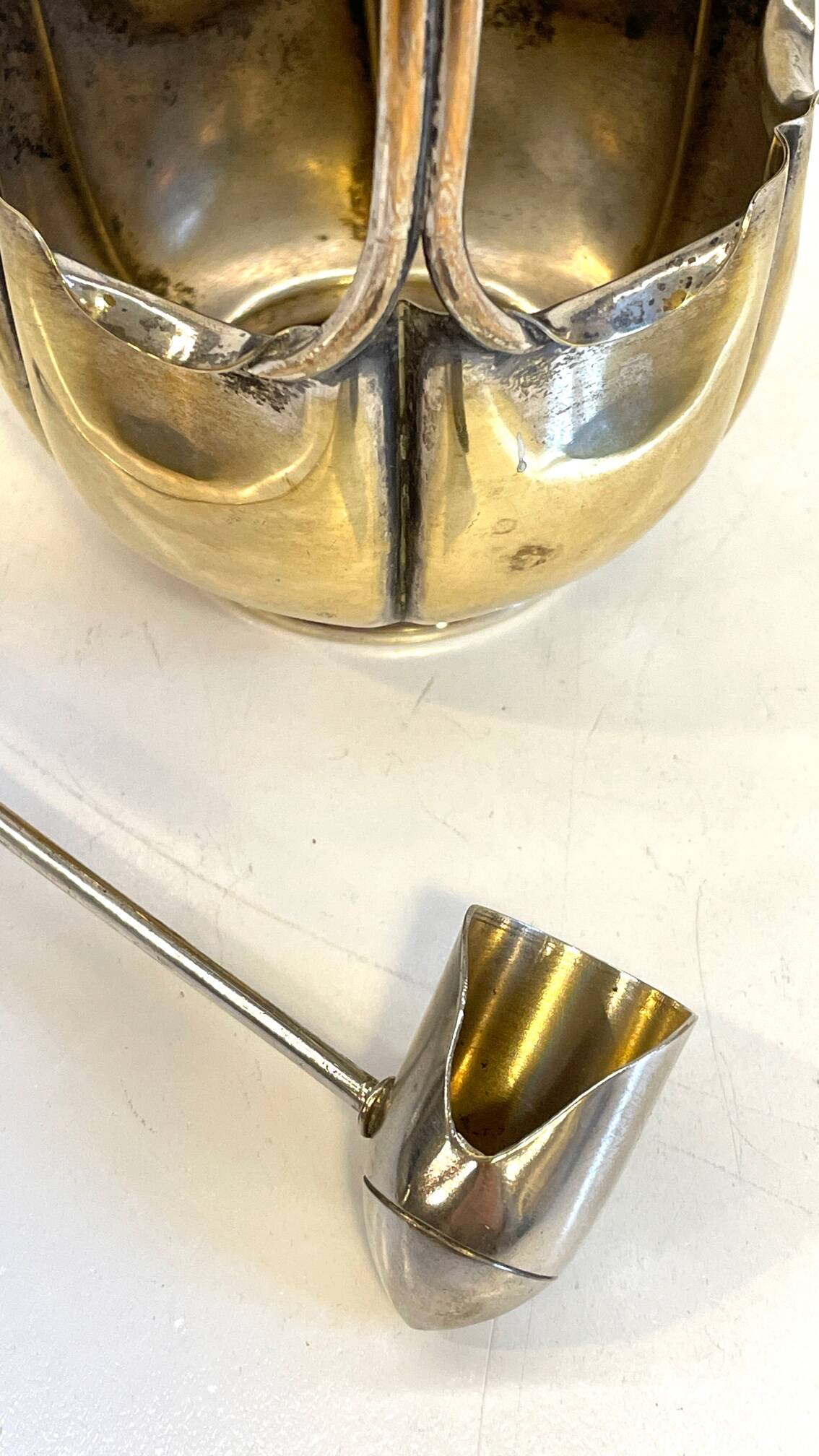 silver metal sugar bowl with gold patina