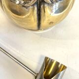 silver metal sugar bowl with gold patina