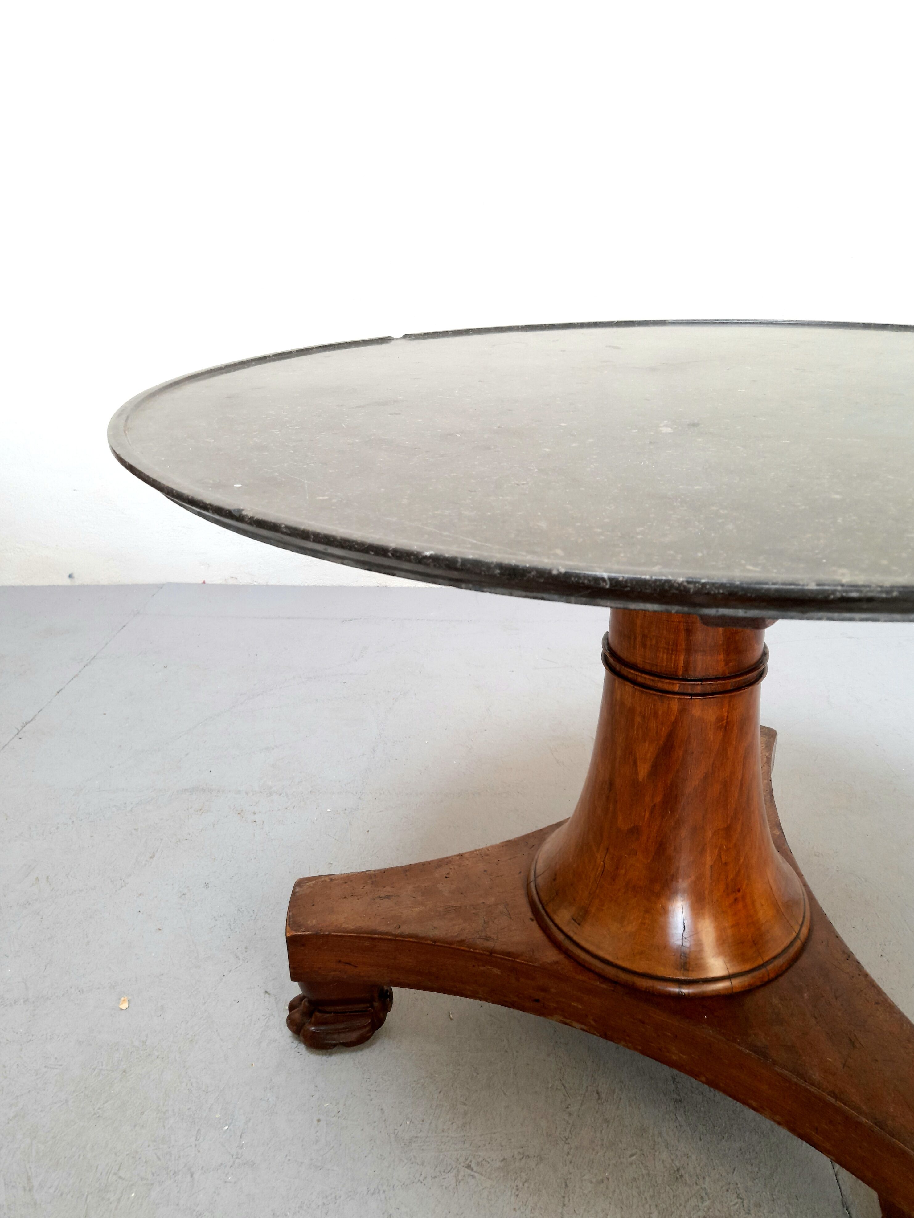 Neo-classical pedestal table in walnut and black marble - French work from the 1930s
