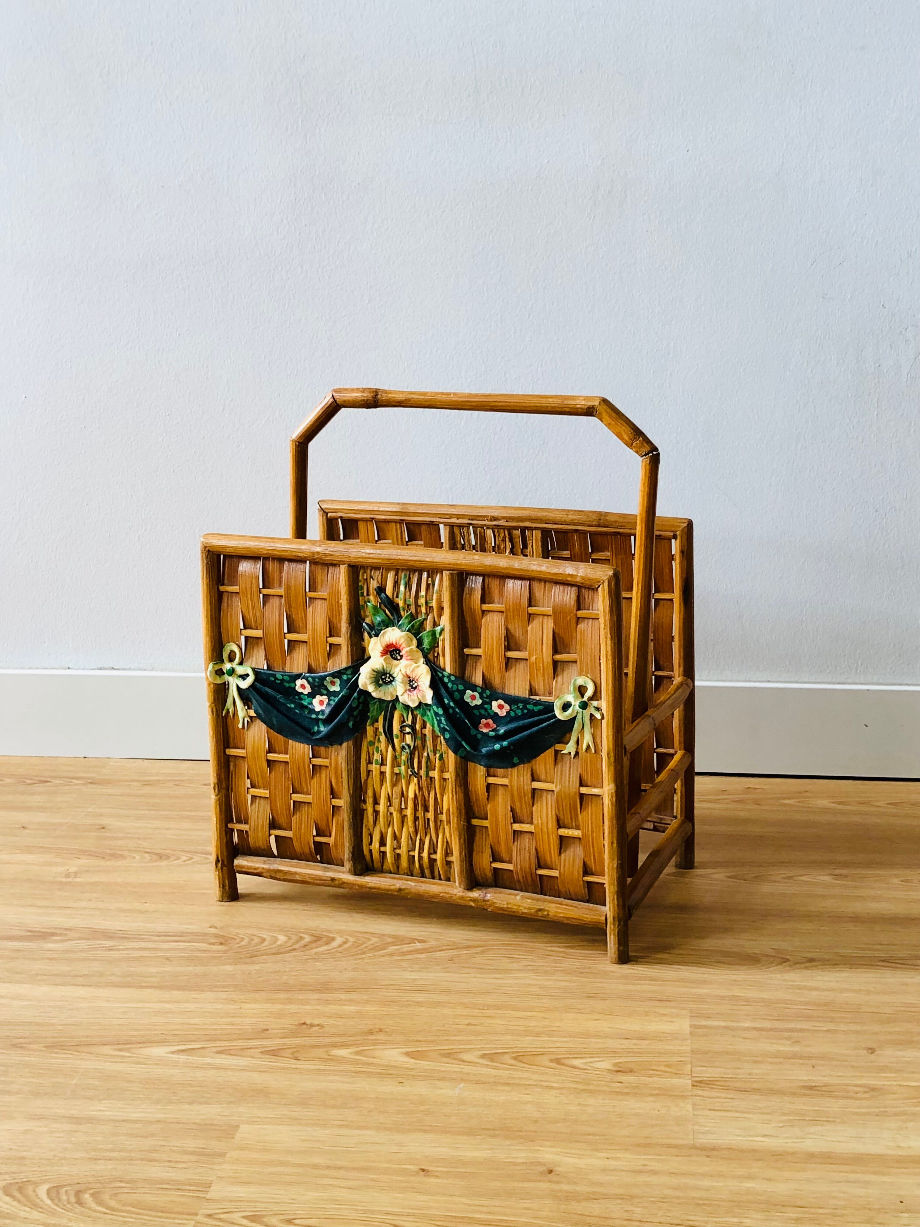 Vintage rattan magazine holder with floral decoration
