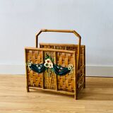 Vintage rattan magazine holder with floral decoration