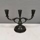 Three-armed candlesticks by Just Andersen, in Disco metal, Denmark, 1950s