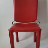 Red leather dining chairs by Arper