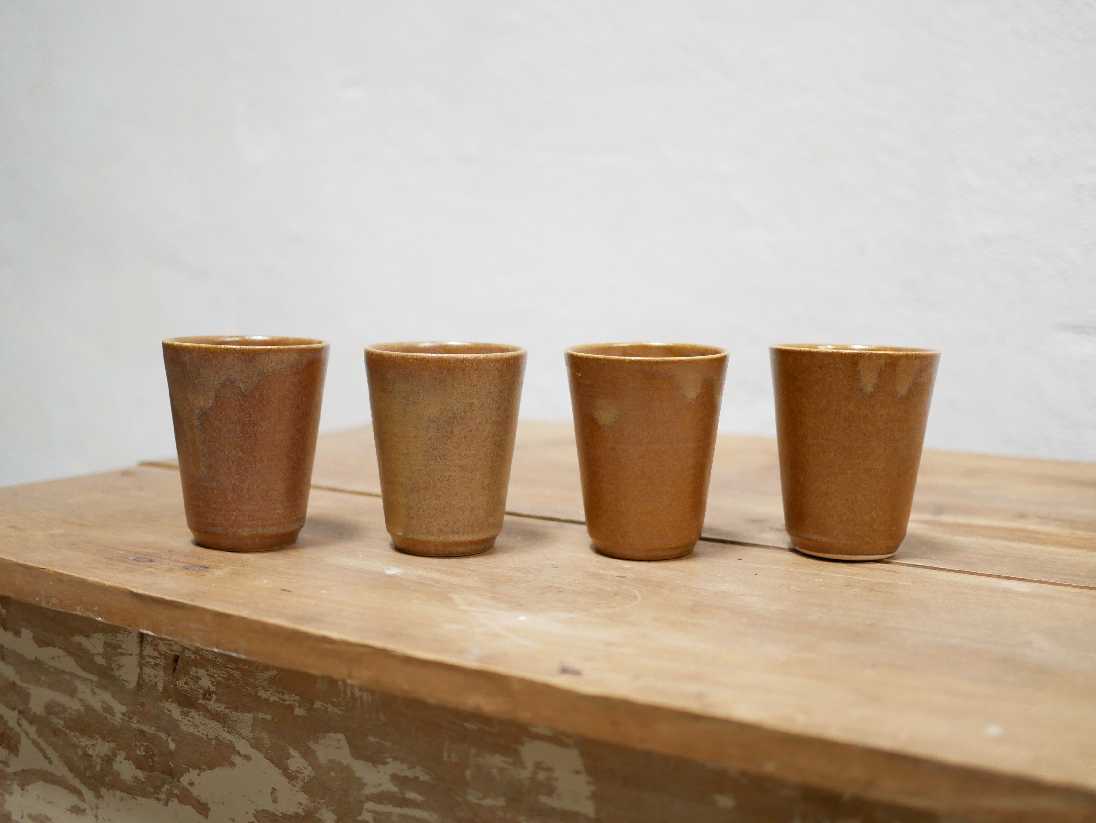 Series of 4 vintage stoneware glasses by the manufacture of Digoin, France
