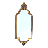 Old small wall mirror in golden resin