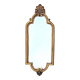 Old small wall mirror in golden resin