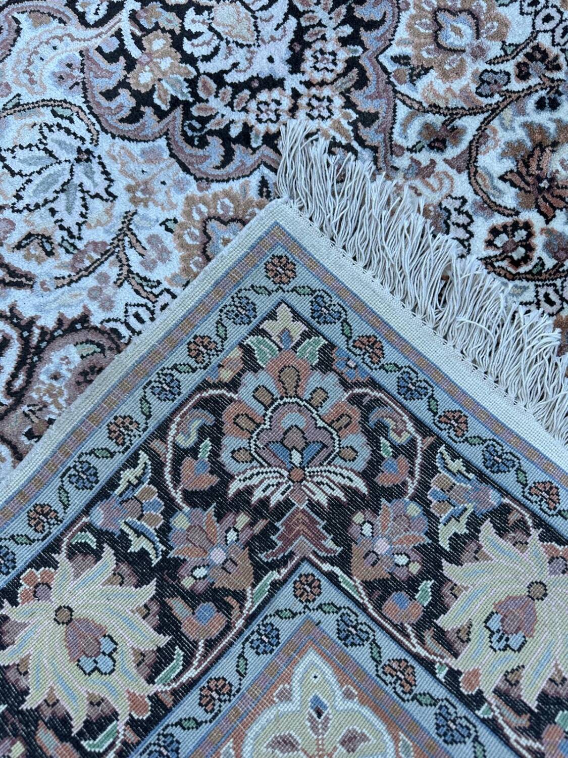 Hand-knotted Persian silk rug