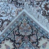 Hand-knotted Persian silk rug