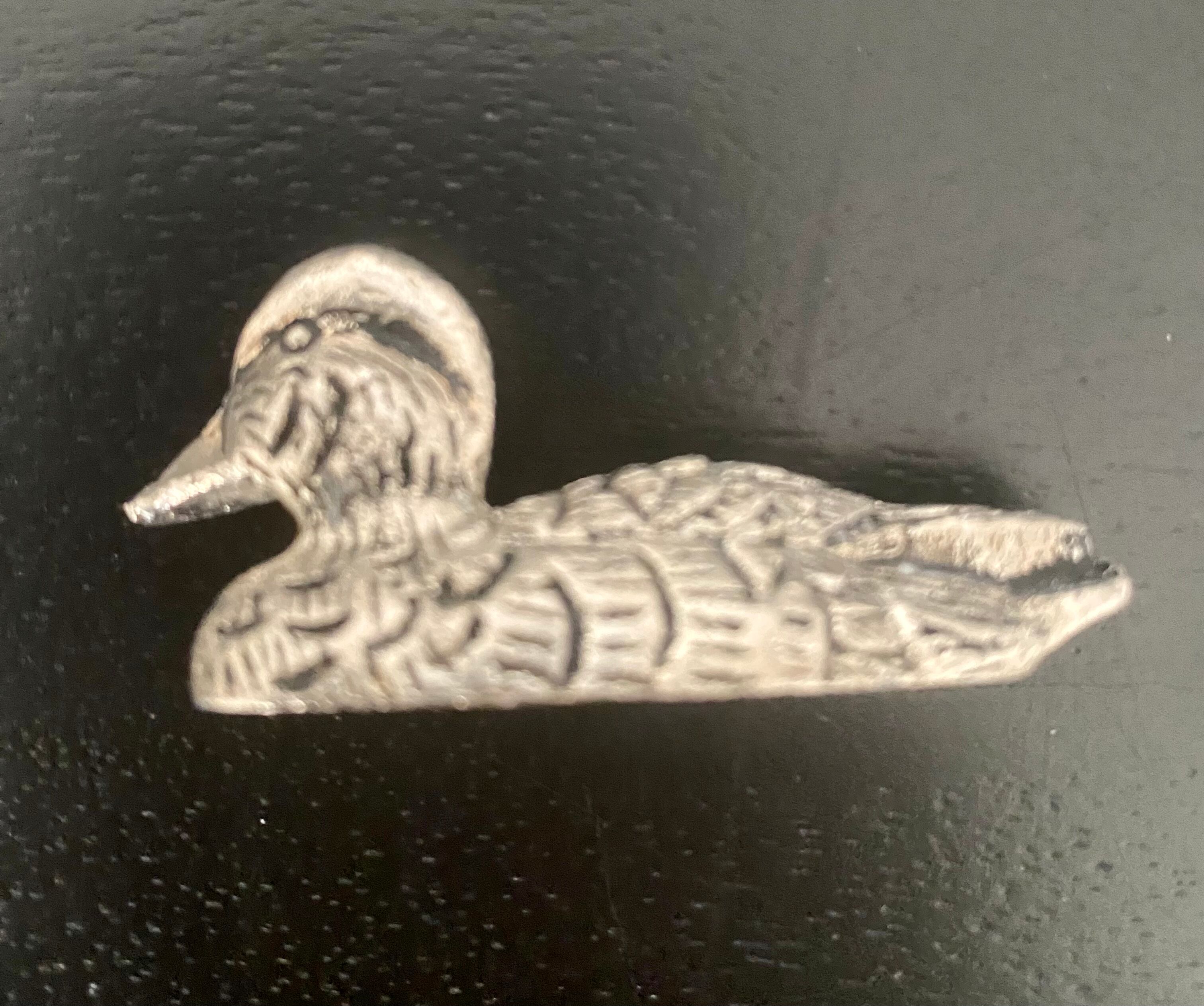 12 metal duck-shaped knife holders