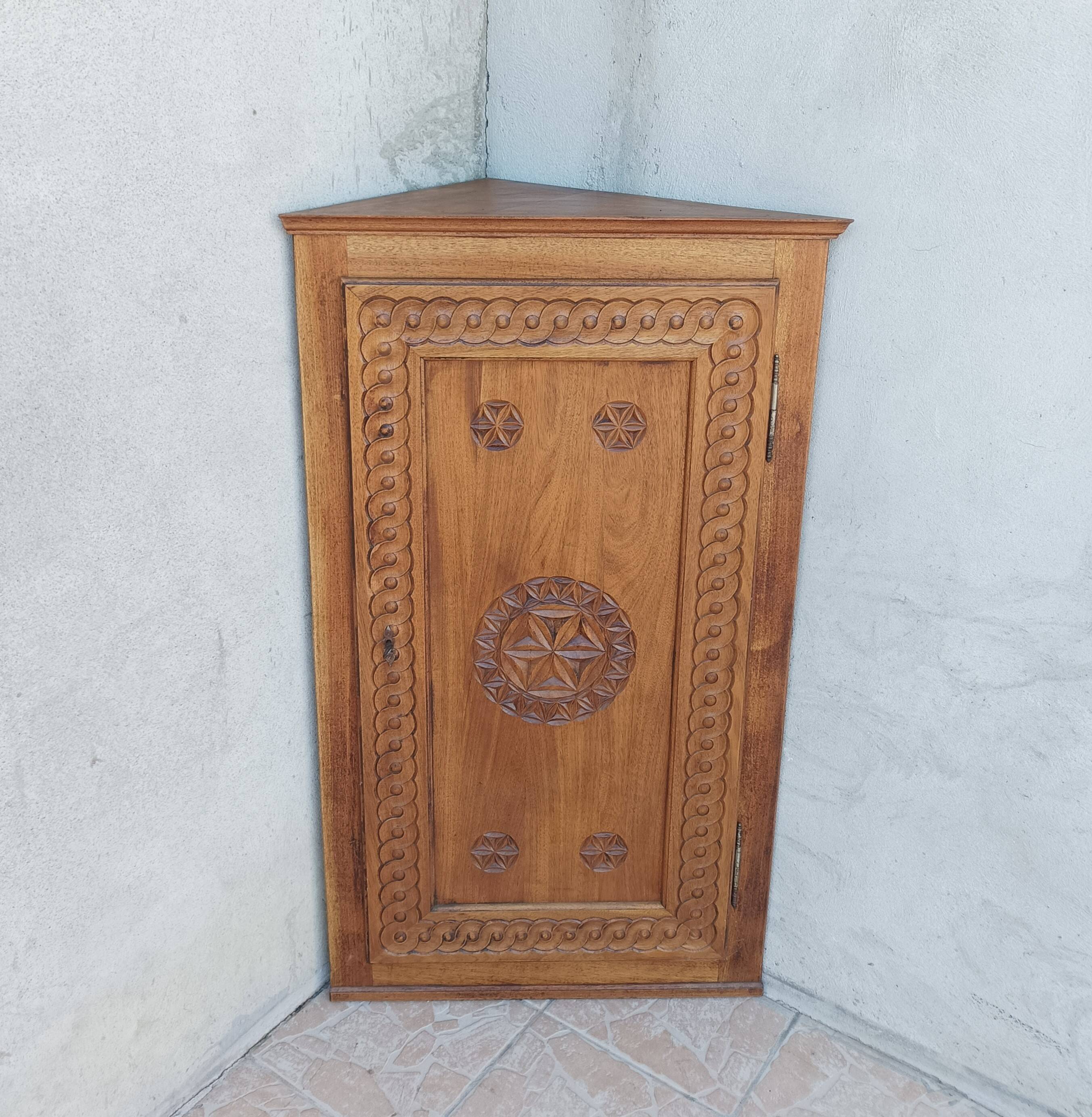 Corner cabinet in carved walnut, Savoyard style.