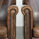 Characterful set of two sheepskin design armchairs with beautiful patina