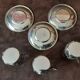 Set of 3 small metal glasses and saucers