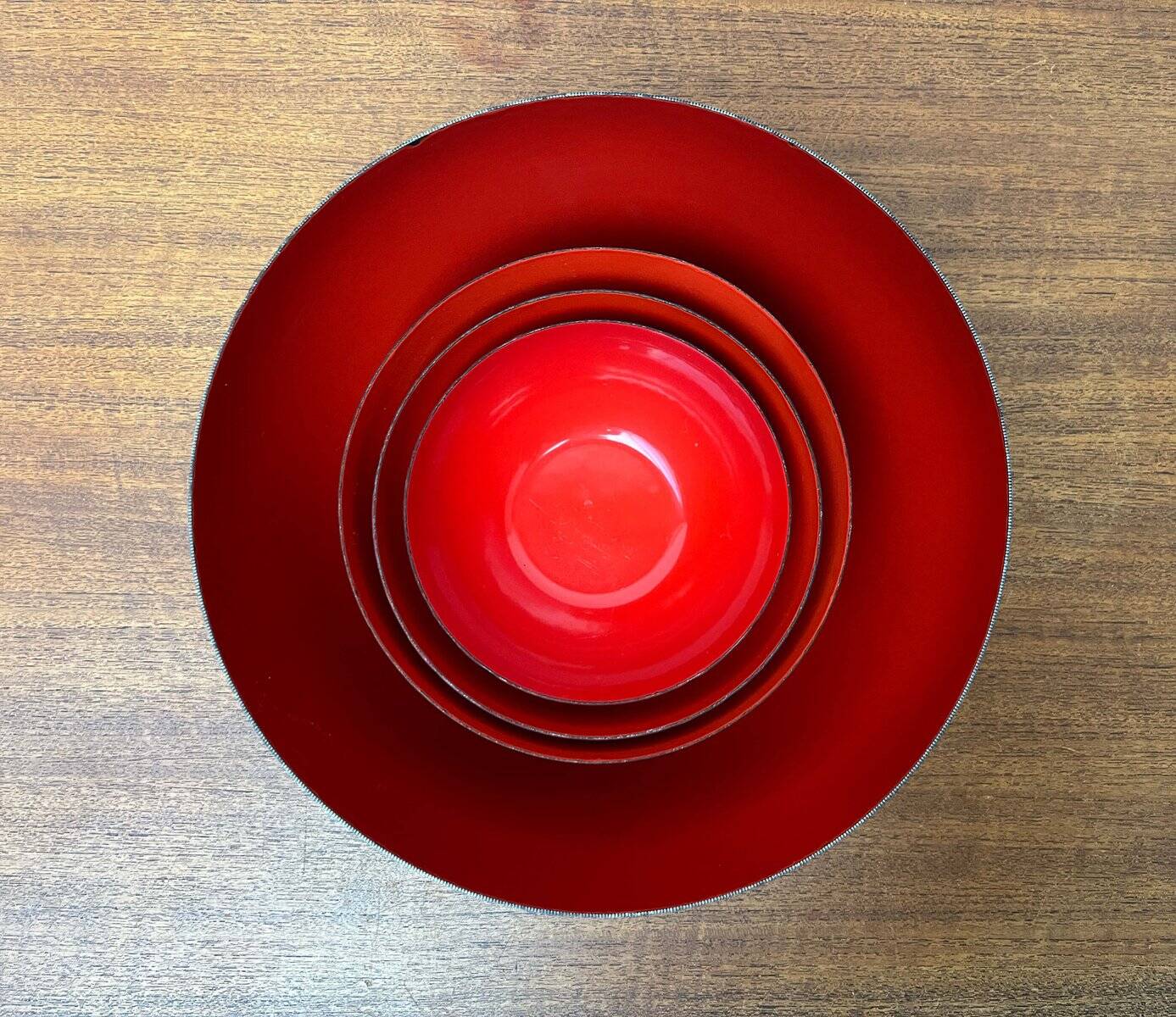 Modern mid-century red enamel bowl sets by Kaj Franck for Finel, Finland, 1960s, set of 4.