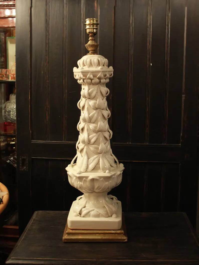 Vintage white ceramic table lamp from Manises with a raised leaf design.