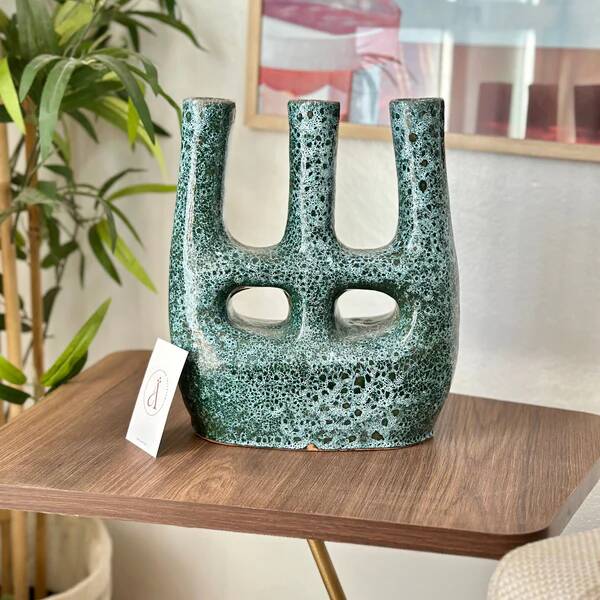 Artisanal vase in black and blue.