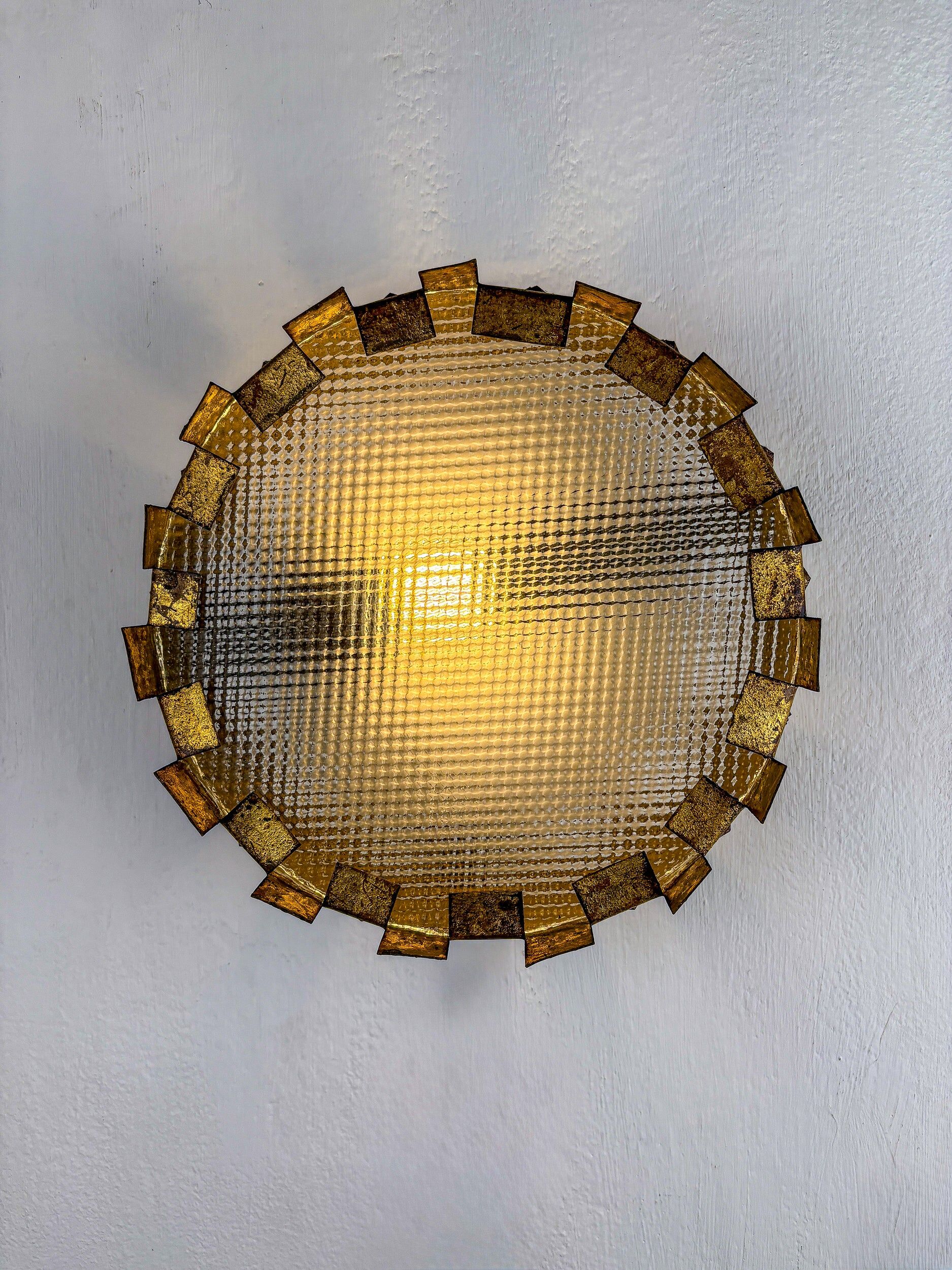 Brutalist crown sunburst fixture in gilt metal and frosted glass, France, 1960s