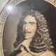 Classic antique man portrait in gilded frame