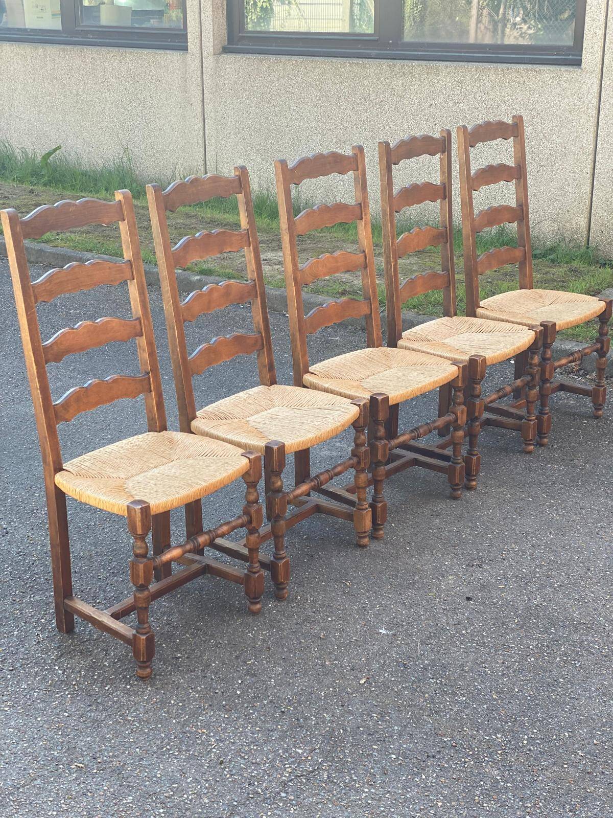 4 or 5 solid wood chairs with light oak straw and high backs