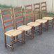 4 or 5 solid wood chairs with light oak straw and high backs