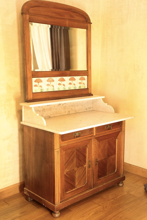 Vintage vanity toilet furniture with marble top.