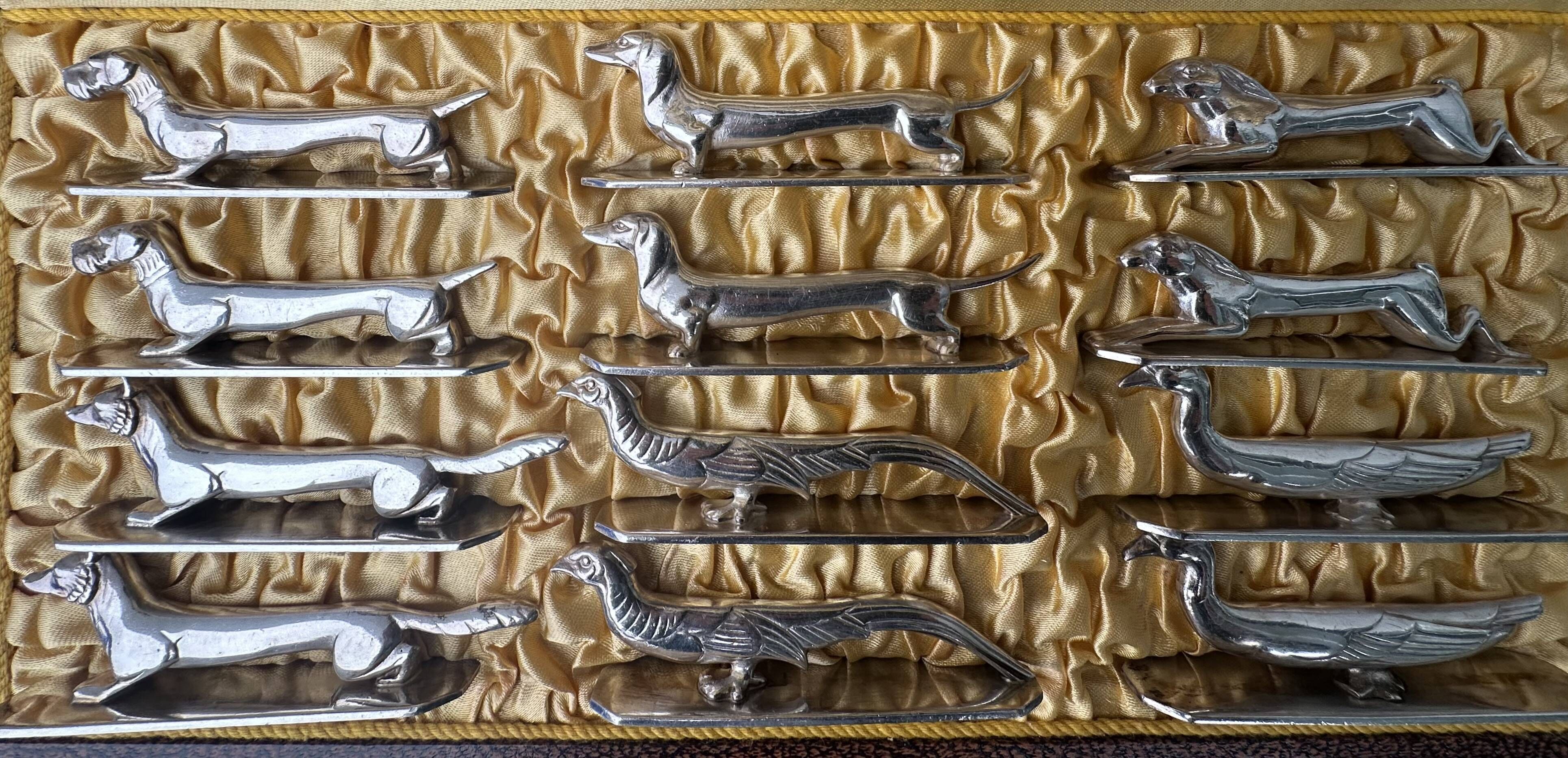 12 antique silver-plated bronze knife rests in modern art deco animal designs.
