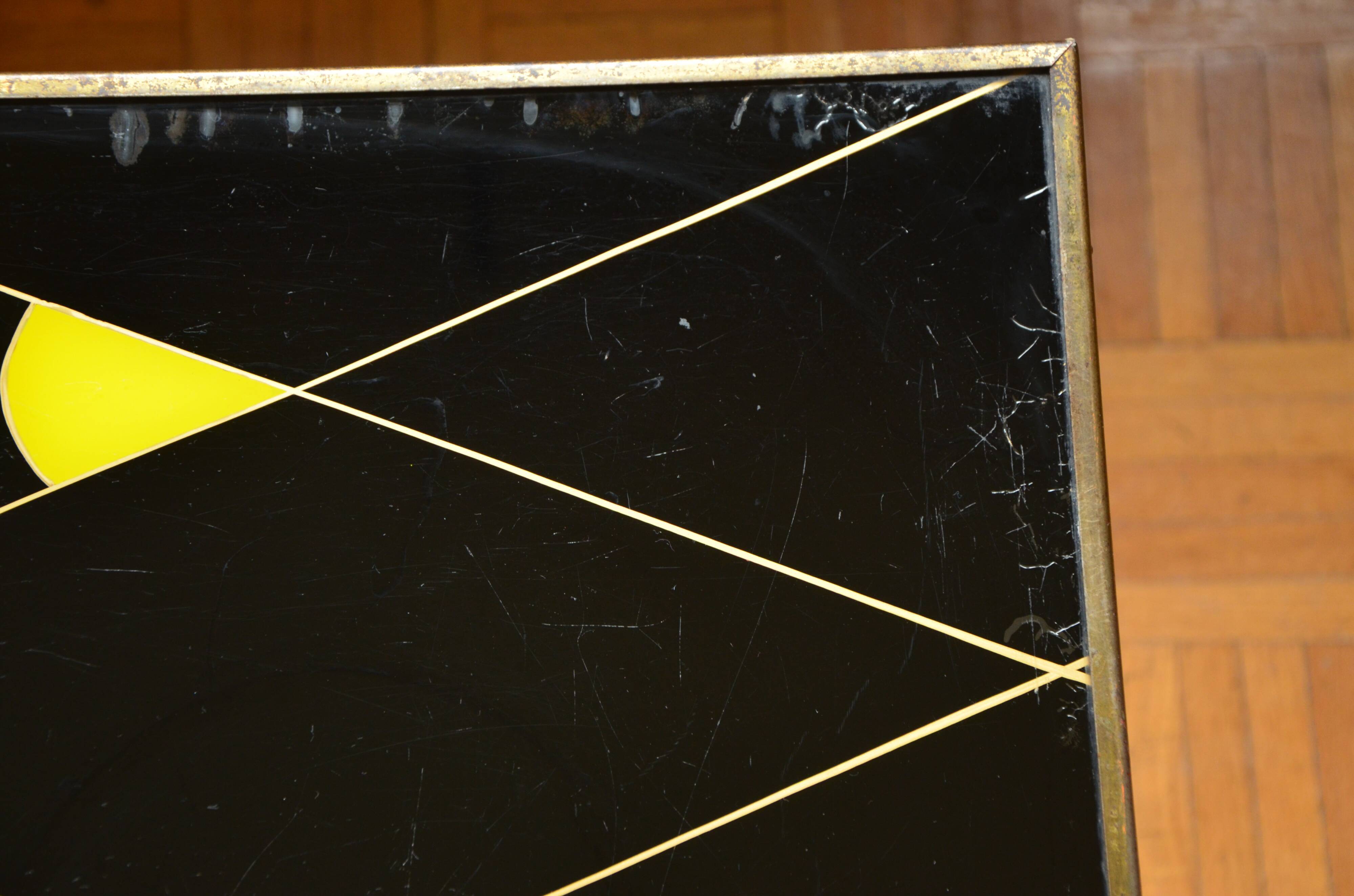 Brass and glass coffee table with compass feet